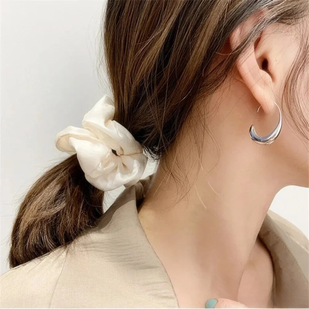 Eleganti Ohrring us Gold und Silber